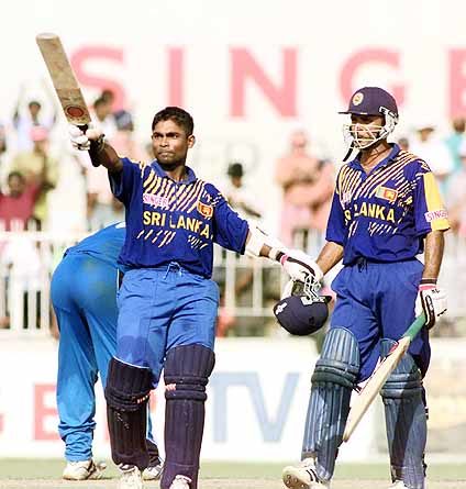 Sri Lankan batsman Romesh Kaluwitharena celebrates as he completes his century during his knock of unbeaten 102 runs against England during the third and final one-day international in Colombo, Sri Lanka on Tuesday, March. 27,2001. Sri Lanka beat England by 10 wickets to win the three match series 3-0.(Photo Leo de Lile)