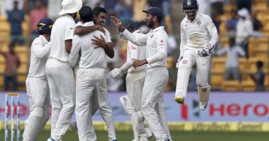 India's Ravichandran Ashwin, center without cap facing camera, celebrates with teammates the dismissal of Australia's Peter Handscomb during the fourth day of their second test cricket match in Bangalore, India, Tuesday, March 7, 2017. (AP Photo/Aijaz Rahi)