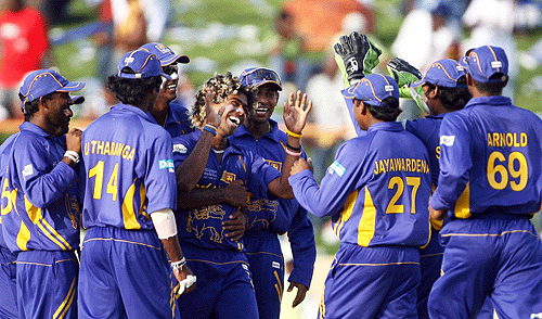 Lasith Malinga is congratulated by his team-mates for becoming the first bowler in ODIs to take four wickets from four balls, South Africa v Sri Lanka, Super Eights, Guyana, March 28, 2007 ©AFP