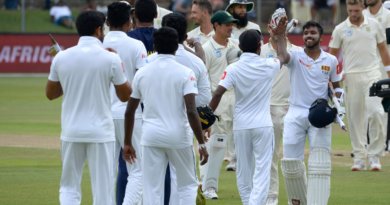 Sri Lanka's Kusal Mendis (R) greets teammates after victory on the third day of the second Test cricket match between South Africa and Sri Lanka at St. George's Park Stadium in Port Elizabeth on February 23, 2019. (Photo by RODGER BOSCH / AFP) (Photo credit should read RODGER BOSCH/AFP/Getty Images)