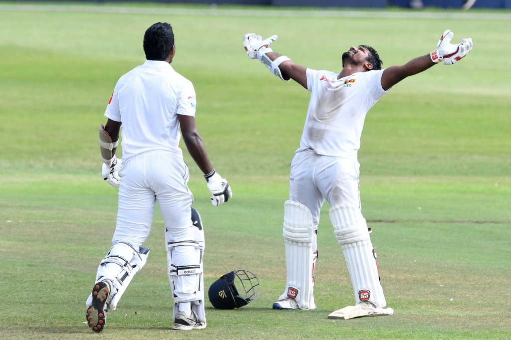 Kusal Perera stretches his arms and looks skyward after taking Sri Lanka to a one-wicket win © Getty Images
