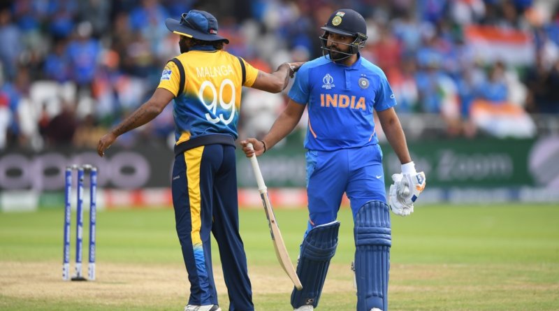 Rohit Sharma is given a pat on the back by Lasith Malinga as he walks back to the pavilion © Getty Images