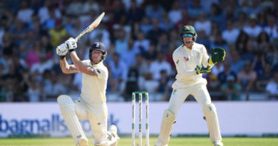 LEEDS, ENGLAND - AUGUST 25: England batsman Ben Stokes hits a ball for 6 runs watched by Tim Paine during day four of the 3rd Ashes Test Match between England and Australia at Headingley on August 25, 2019 in Leeds, England. (Photo by Stu Forster/Getty Images)