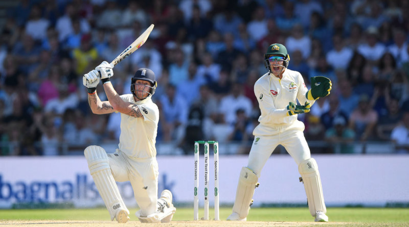 LEEDS, ENGLAND - AUGUST 25: England batsman Ben Stokes hits a ball for 6 runs watched by Tim Paine during day four of the 3rd Ashes Test Match between England and Australia at Headingley on August 25, 2019 in Leeds, England. (Photo by Stu Forster/Getty Images)