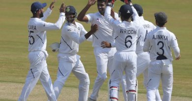 Indian bowler Ravichandran Ashwin, with out cap, celebrates with team members after dismissing South Africa's Theunis de Bruyn during the fifth day of the first cricket test match against South Africa in Visakhapatnam, India, Sunday, Oct. 6, 2019. (AP Photo/Mahesh Kumar A.)