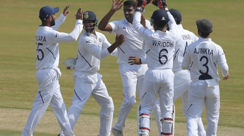 Indian bowler Ravichandran Ashwin, with out cap, celebrates with team members after dismissing South Africa's Theunis de Bruyn during the fifth day of the first cricket test match against South Africa in Visakhapatnam, India, Sunday, Oct. 6, 2019. (AP Photo/Mahesh Kumar A.)