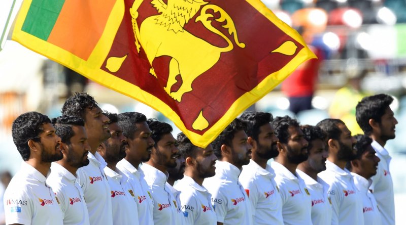 Sri Lanka's captain Dinesh Chandima (L) and teammates line up for the national anthem to celebrate the 71st Independence day before the start of day four of the second Test cricket match between Australia and Sri Lanka at the Manuka Oval Cricket Ground in Canberra on February 4, 2019. (Photo by ISHARA S. KODIKARA / AFP) / -- IMAGE RESTRICTED TO EDITORIAL USE - STRICTLY NO COMMERCIAL USE -- (Photo credit should read ISHARA S. KODIKARA/AFP/Getty Images)