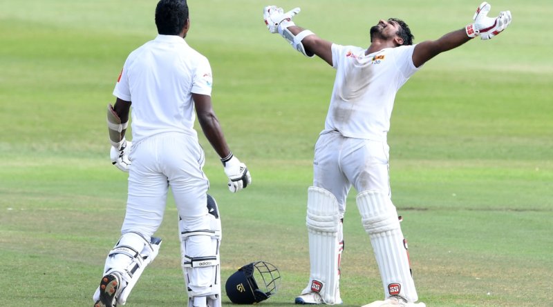 Kusal Perera stretches his arms and looks skyward after taking Sri Lanka to a one-wicket win © Getty Images