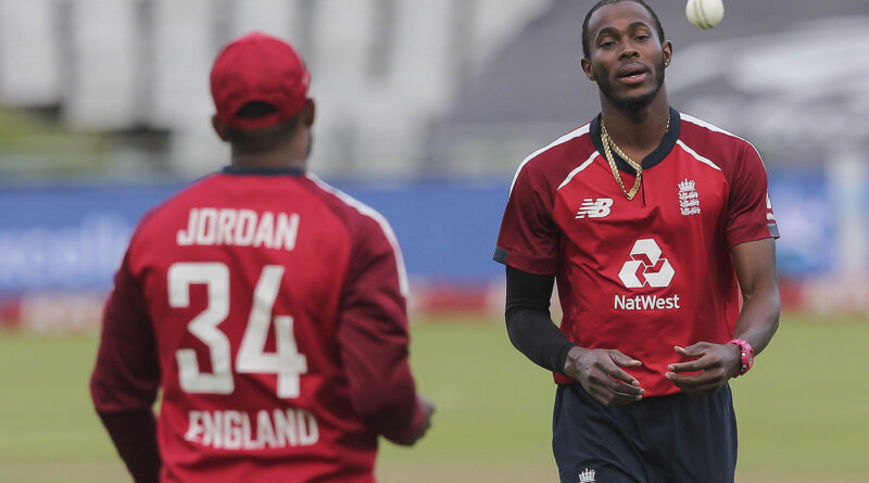 Jofra Archer receives the ball from Chris Jordan between bowls during the third T20 cricket match between South Africa and England in Cape Town, South Africa, Sunday, Nov. 29, 2020. (AP Photo/Halden Krog)