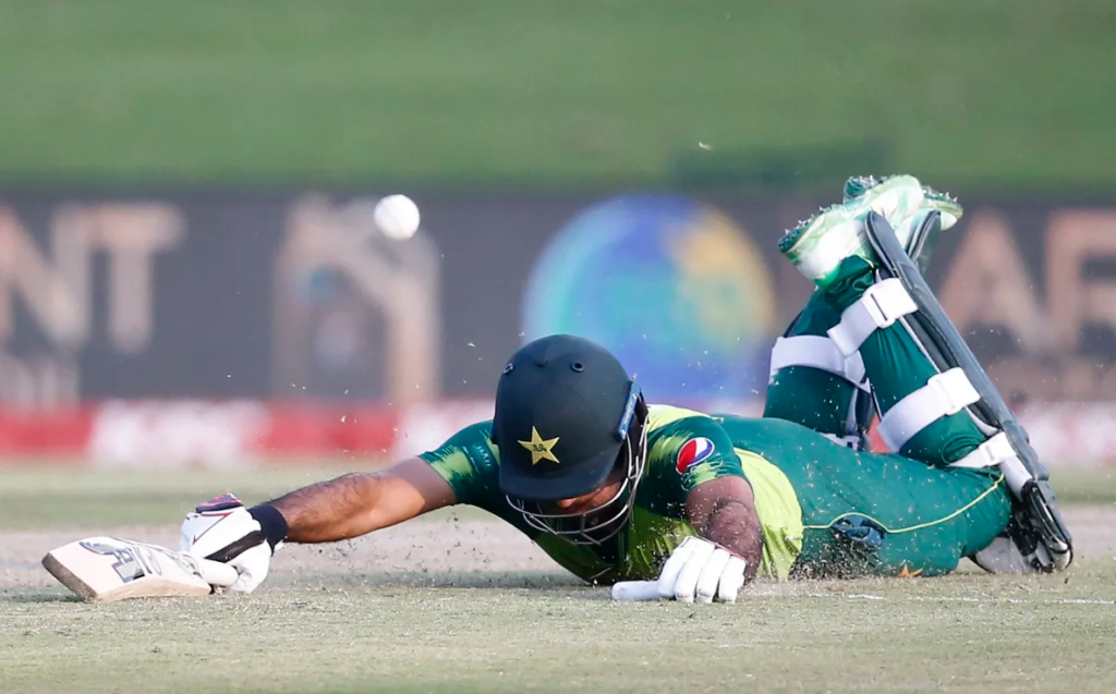 Fakhar Zaman dives to make his ground•Apr 16, 2021•AFP/Getty Images