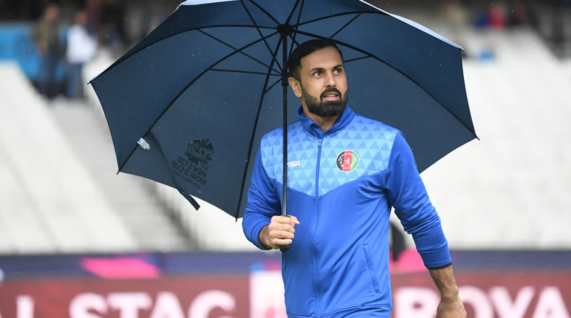 Mohammad Nabi takes a stroll as the rain pelts down•Oct 28, 2022•ICC via Getty