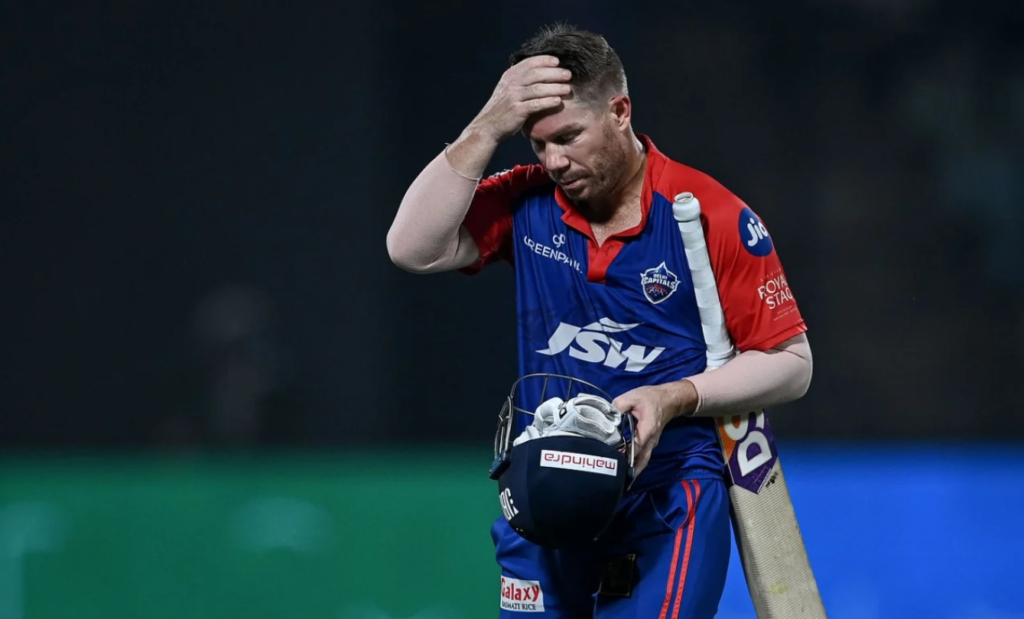 A dejected David Warner walks off after his 27-ball 54•May 13, 2023•AFP/Getty Images