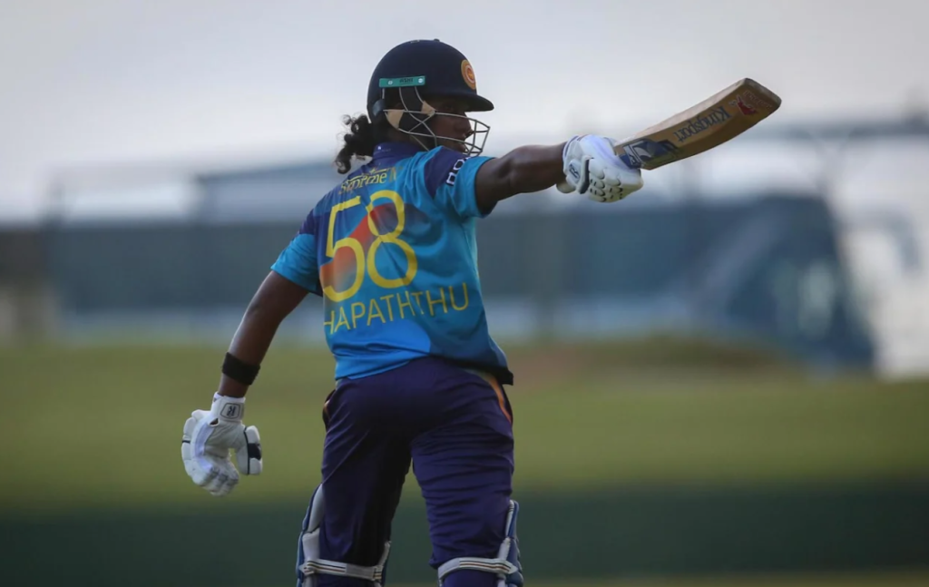 Chamari Athapaththu acknowledges the dressing room after getting to her century•Jun 27, 2023•Getty Images