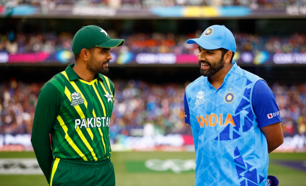 Rohit Sharma and Babar Azam catch up during the toss•Oct 23, 2022•Getty Images/ICC