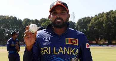 Wanindu Hasaranga holds the ball up after bagging five wickets against Oman•Jun 23, 2023•ICC/Getty Images
