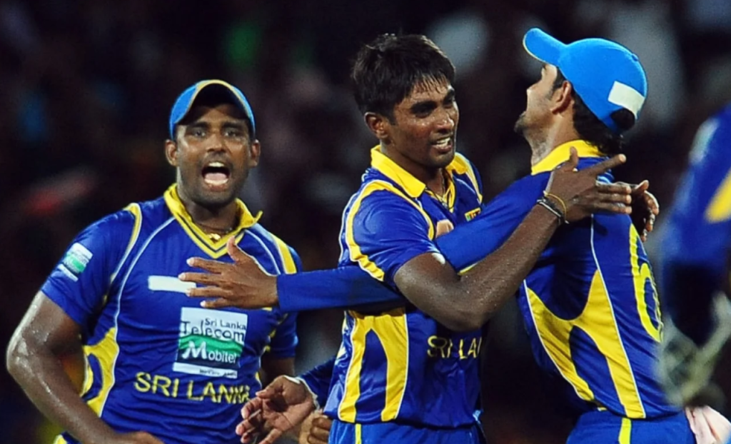 Nuwan Pradeep is congratulated after taking Rohit Sharma's wicket•Jul 31, 2012•AFP