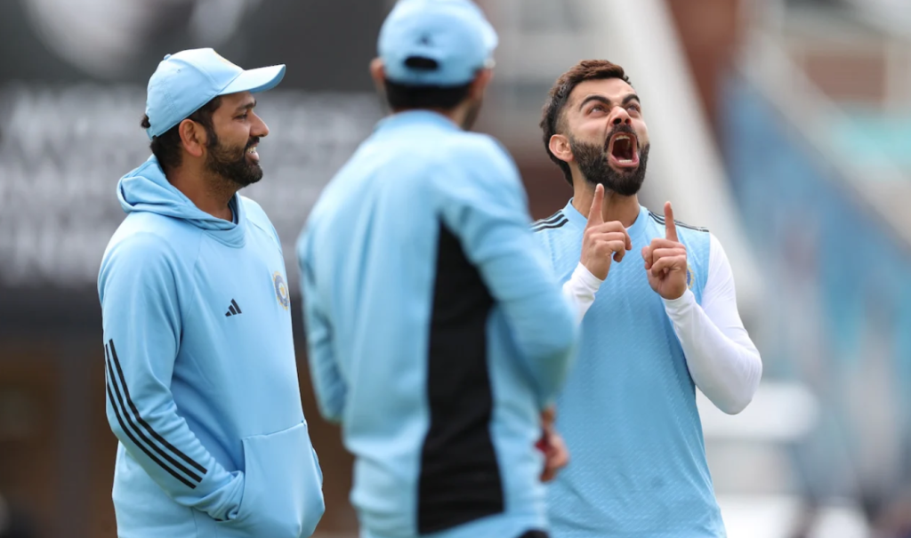 Virat Kohli has some fun while Rohit Sharma looks on•Jun 05, 2023•ICC via Getty Images