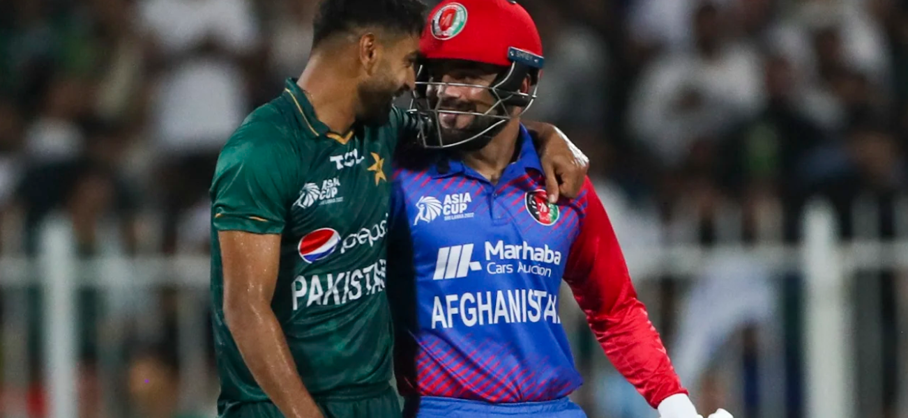 Haris Rauf and Rashid Khan share a light moment on field•Sep 07, 2022•AFP/Getty Images