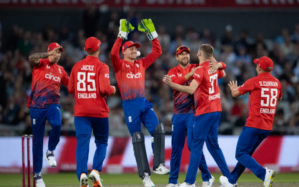 England's fielders celebrate as Gus Atkinson claims Devon Conway for his first international wicket•Sep 01, 2023•AFP/Getty Images