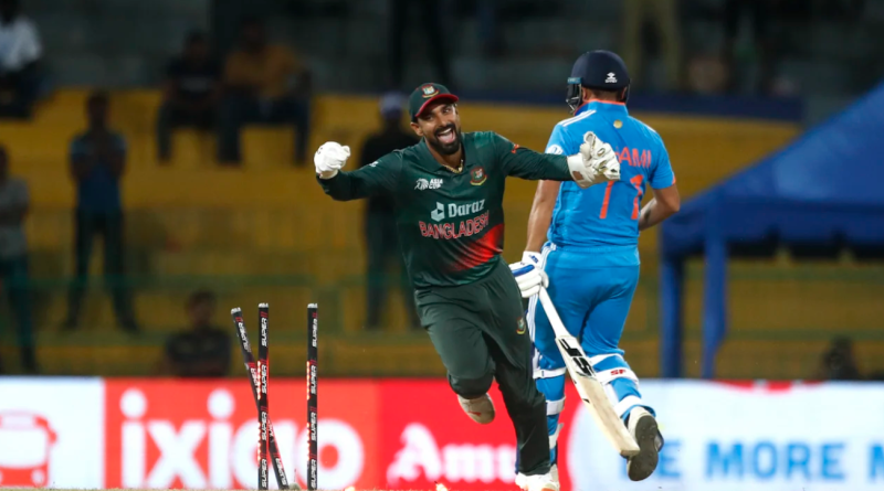 Litton Das breaks the stumps to run Mohammed Shami out and complete Bangladesh's win•Sep 15, 2023•Getty Images