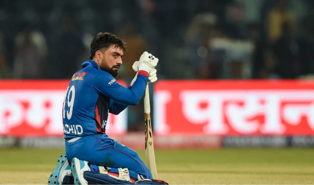 Rashid Khan sinks to his knees after Afghanistan crashed out of the Asia Cup•Sep 05, 2023•AFP/Getty Images