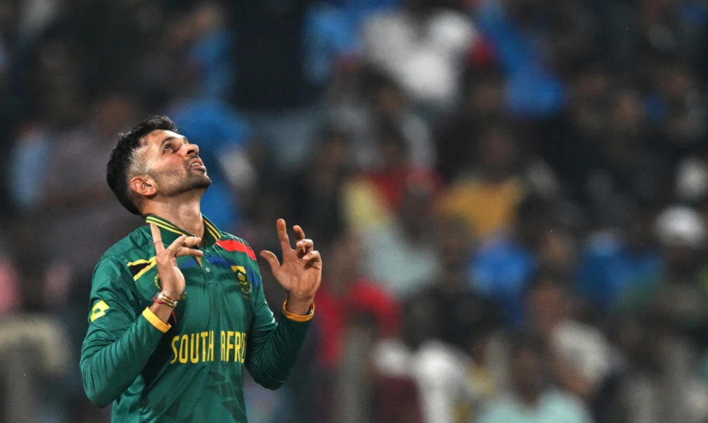 Keshav Maharaj celebrates after dismissing Daryl Mitchell•Nov 01, 2023•AFP/Getty Images