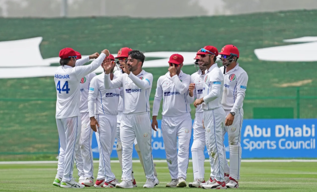 Rashid Khan bumps fists with captain Asghar Afghan•Mar 13, 2021•Abu Dhabi Cricket