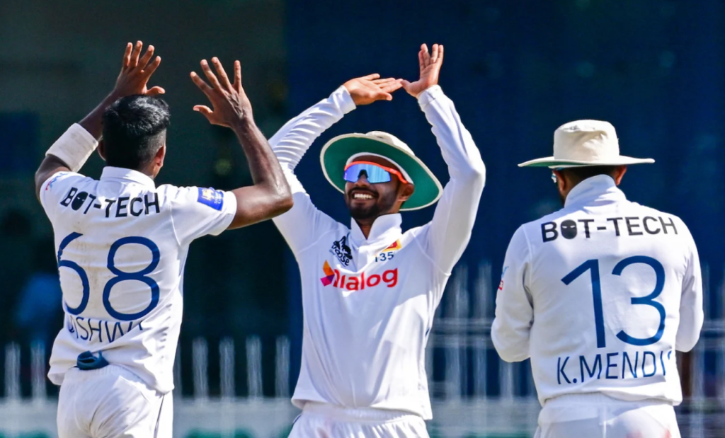 Vishwa Fernando celebrates a wicket with Dhananjaya de Silva•Feb 02, 2024•AFP/Getty Image